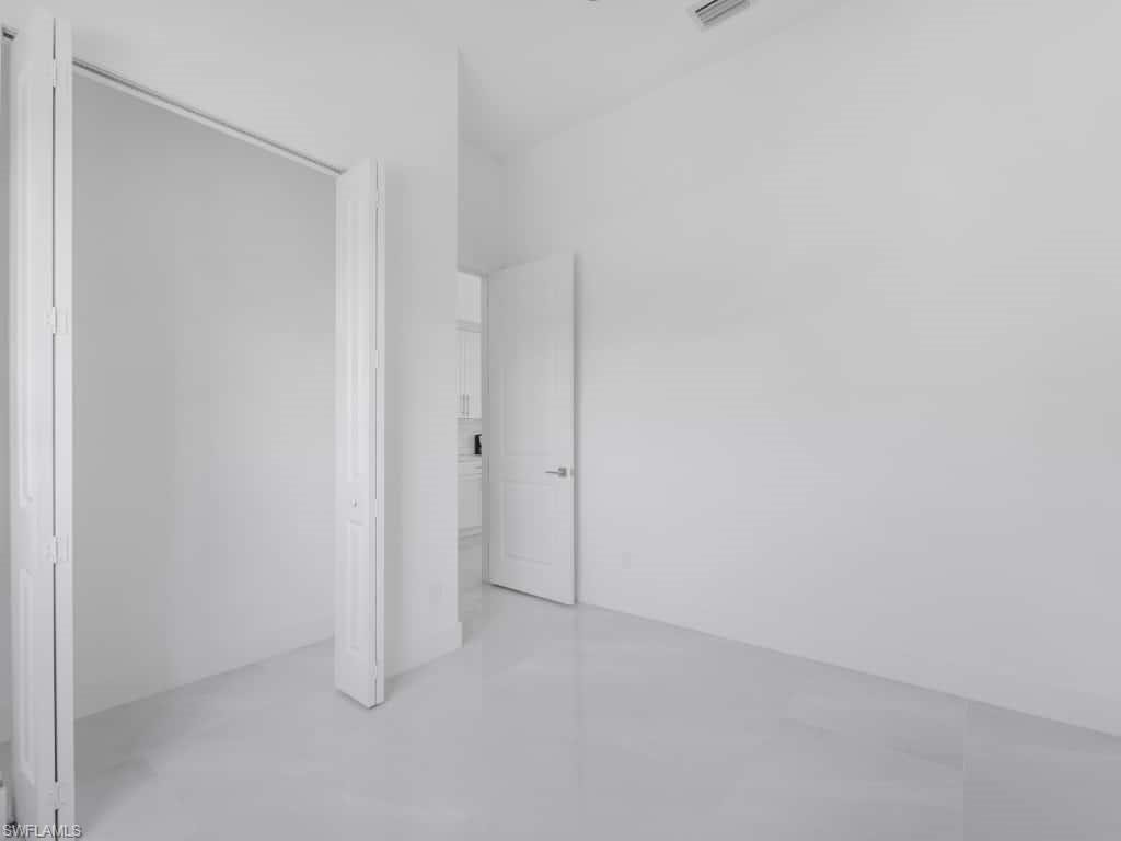 Laundry room with hookup for an electric dryer, hookup for a washing machine, and cabinet space
