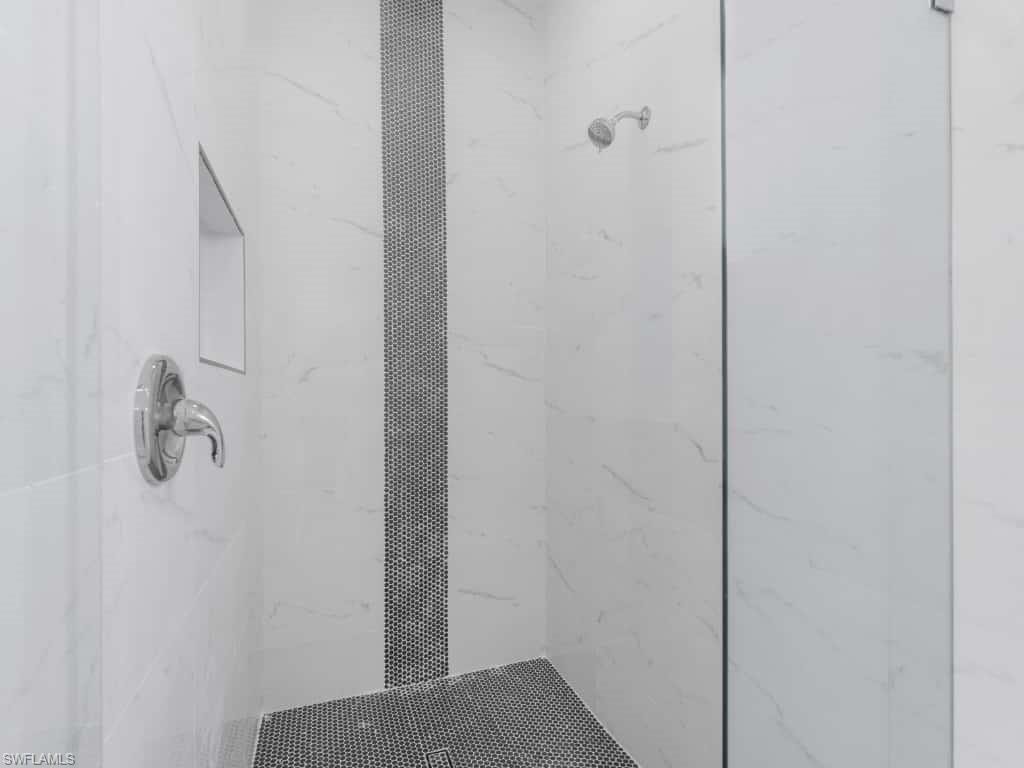 Full bath featuring vanity and shower / tub combination