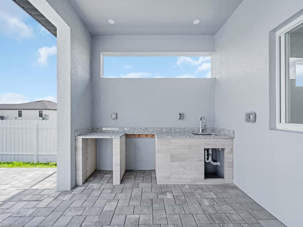View of patio / terrace with area for grilling and a sink