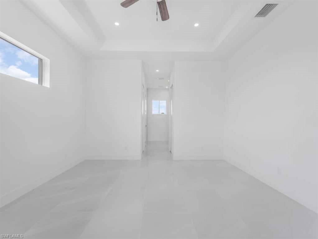 Spare room with ceiling fan