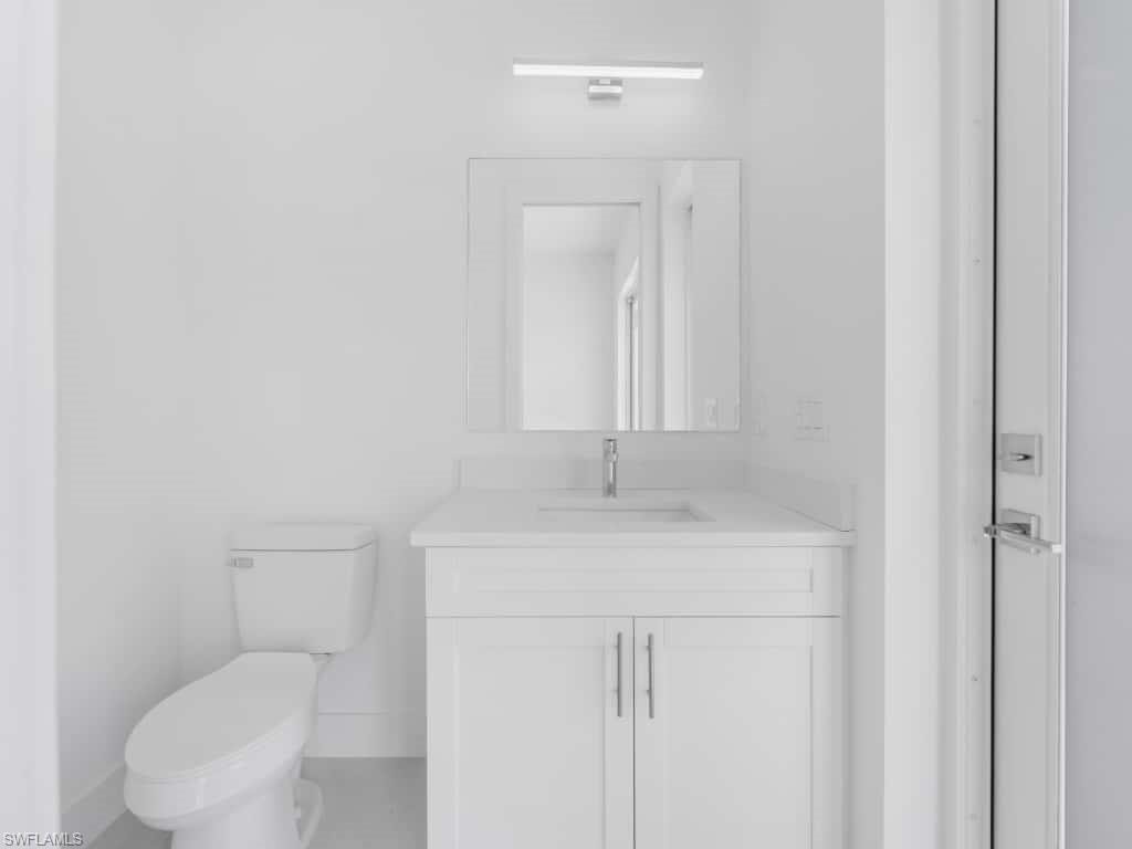 Hall featuring light tile patterned floors and recessed lighting