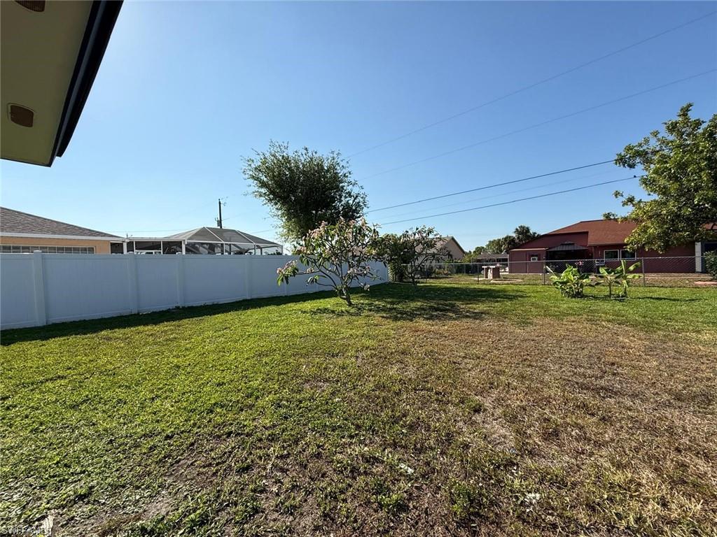 View of yard with fence