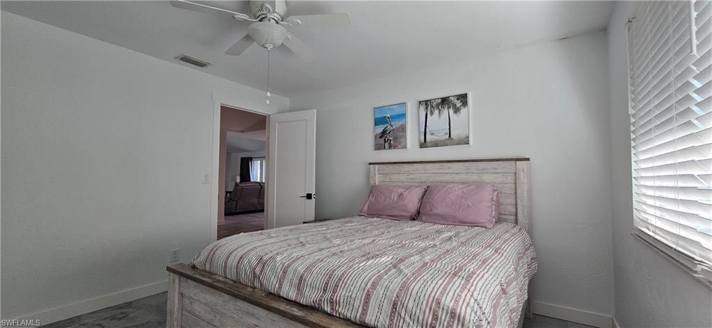 Bedroom featuring baseboards and a ceiling fan