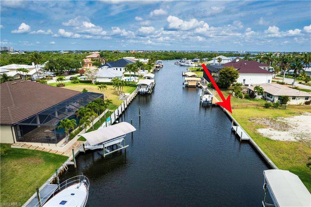 Aerial view of residential area featuring a large body of water