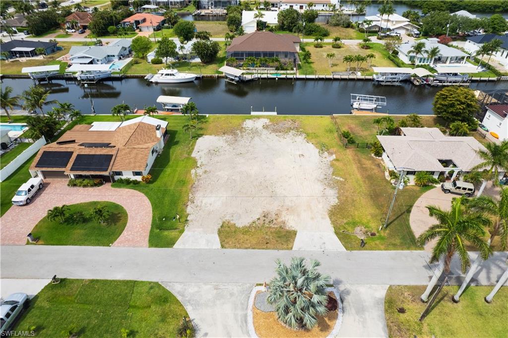 Aerial perspective of suburban area with a large body of water
