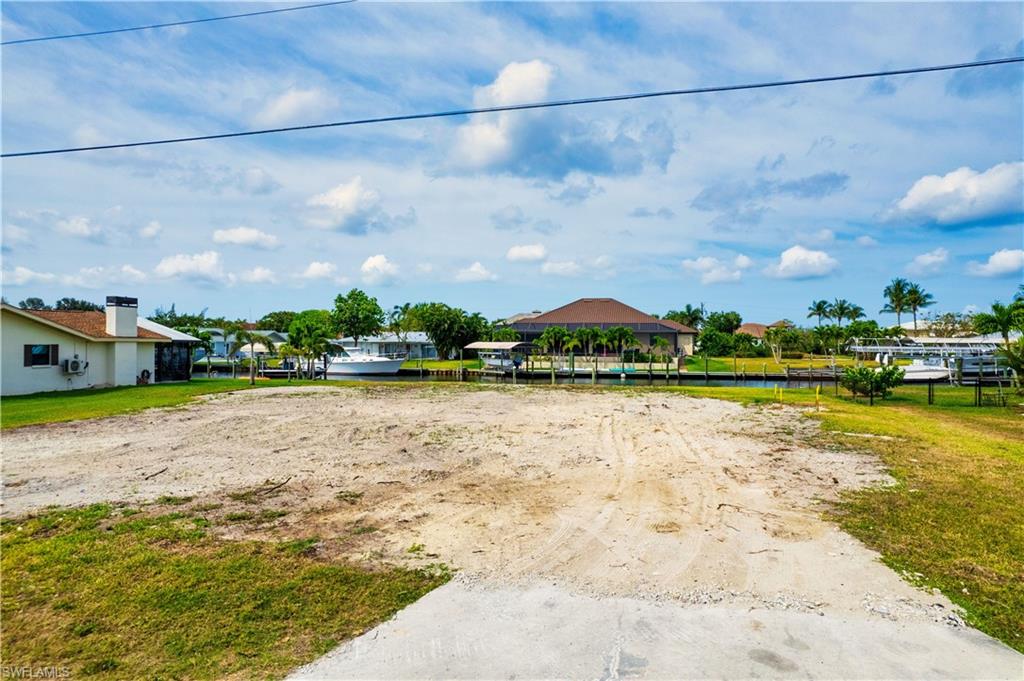 View of yard with a water view