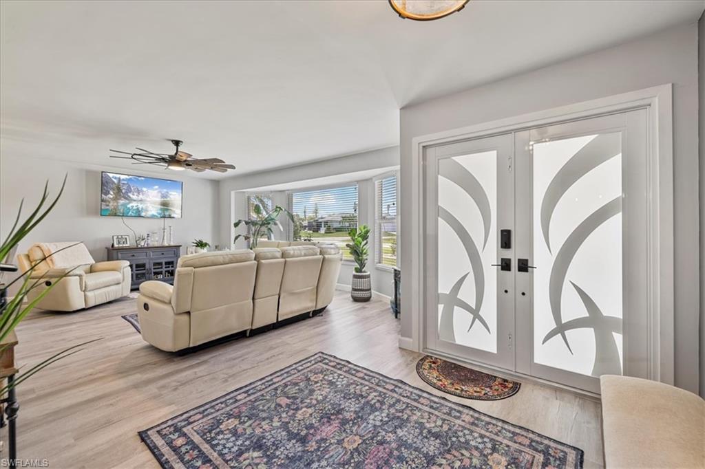 Entryway featuring wood finished floors and a ceiling fan