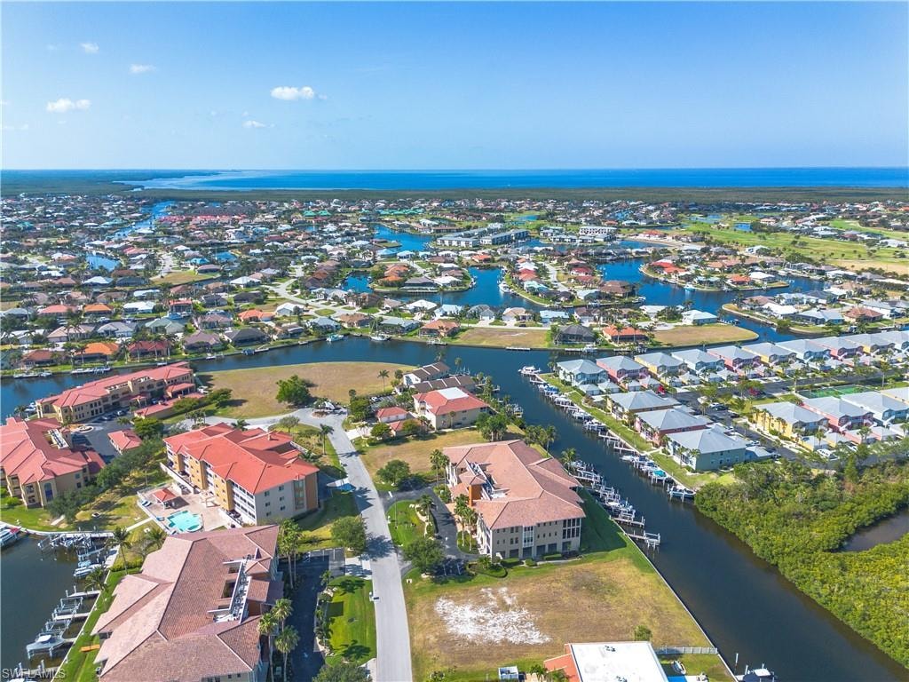 Aerial perspective of suburban area with a large body of water