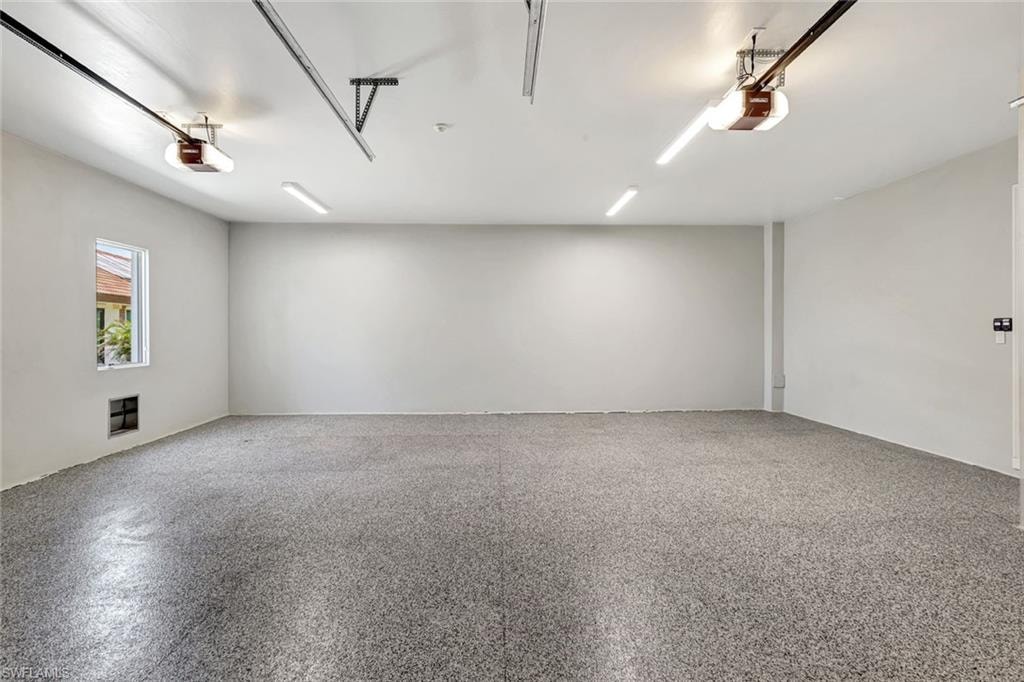Oversized 2 car garage View of empty room