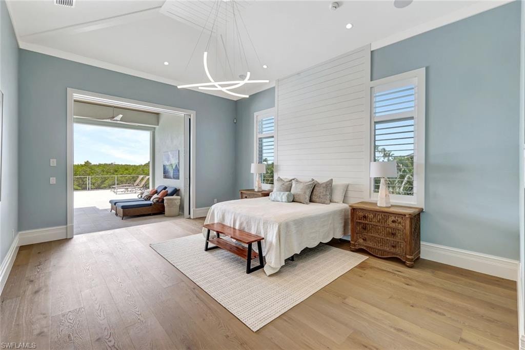 Master Bedroom featuring baseboards, light wood finished floors, a chandelier, access to exterior, and recessed lighting