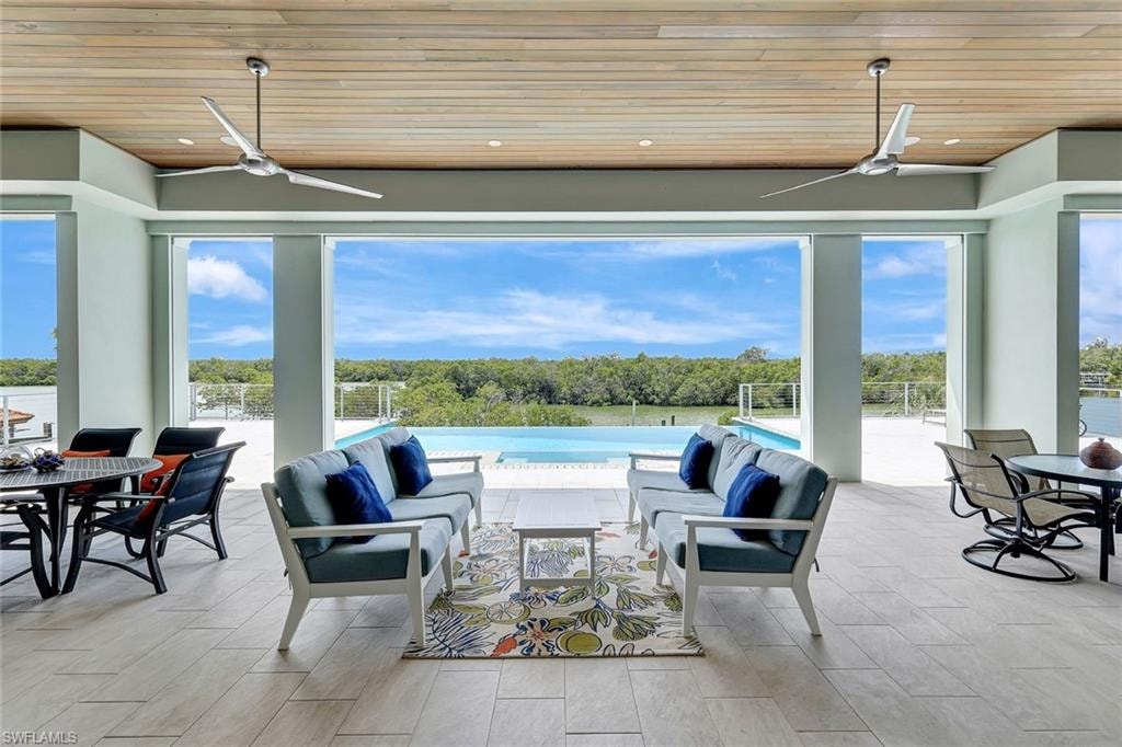 View of patio / terrace with ceiling fan, an outdoor living space, and outdoor dining area