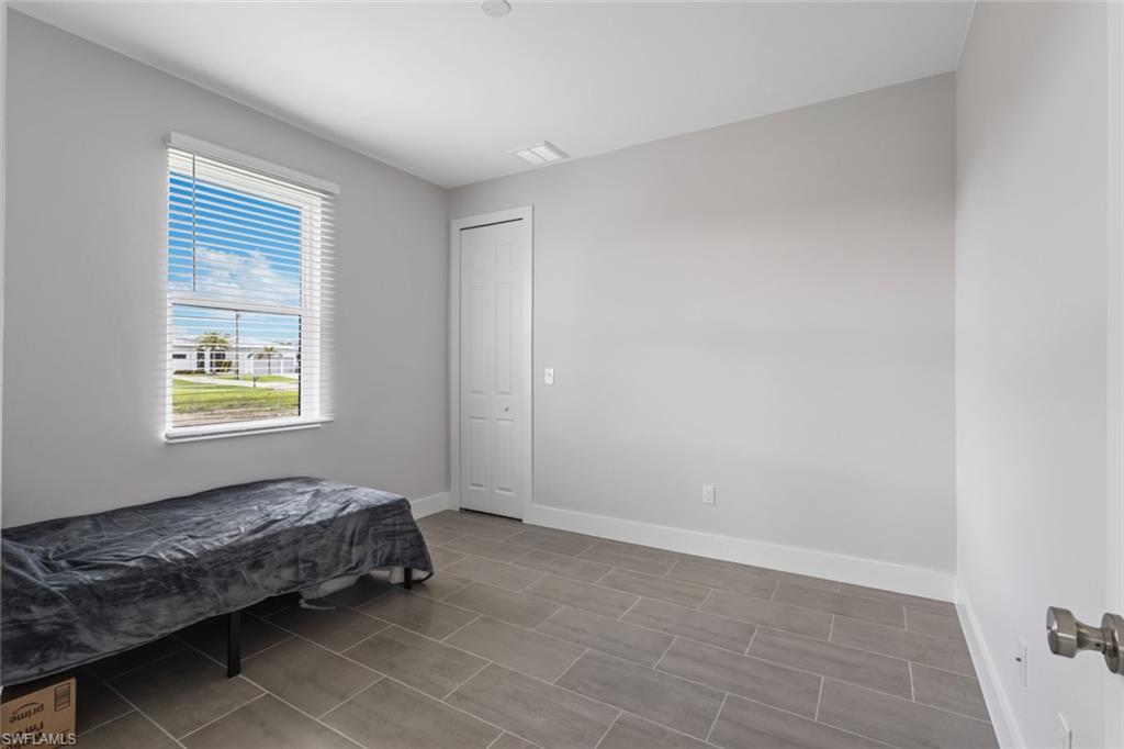 Bedroom featuring baseboards