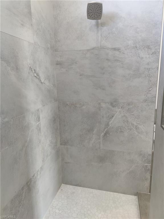 Bathroom with a tile shower