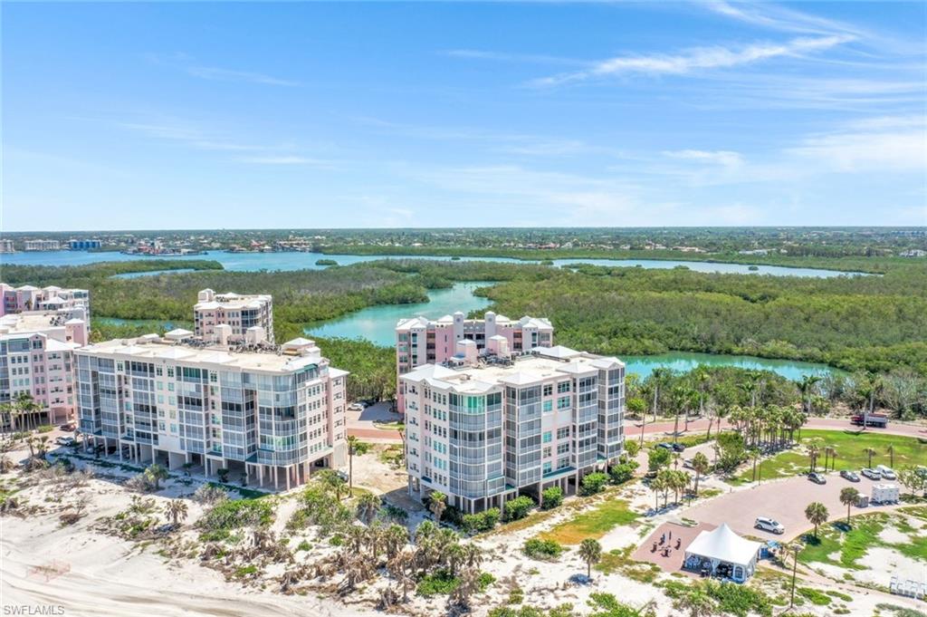 Aerial view of apartment complex / building and a nearby body of water