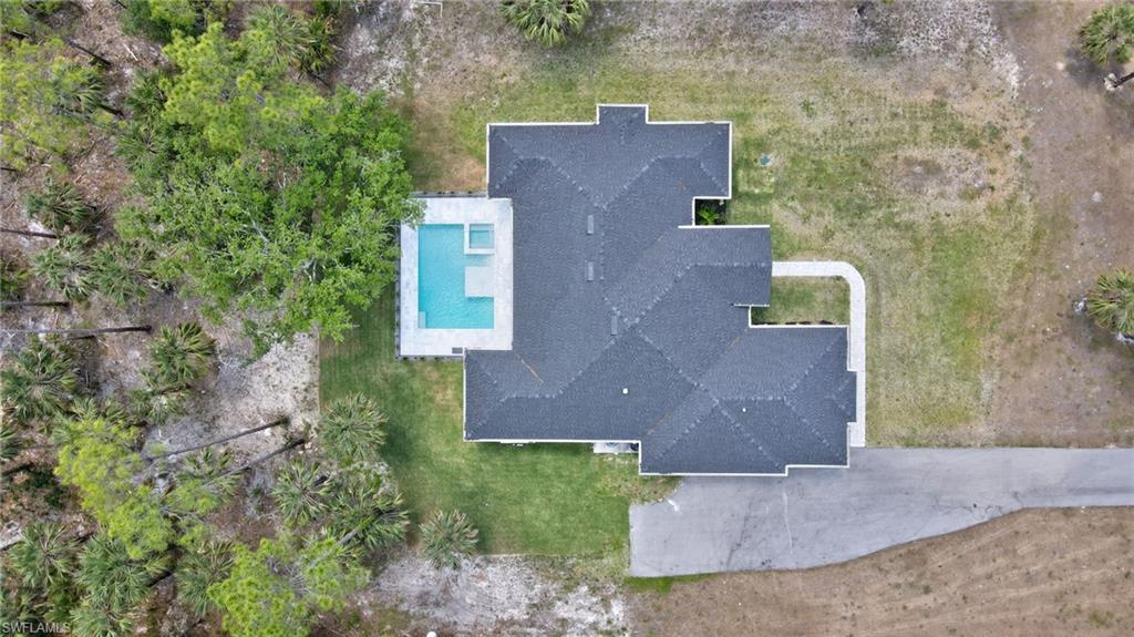View of subject property featuring a pool
