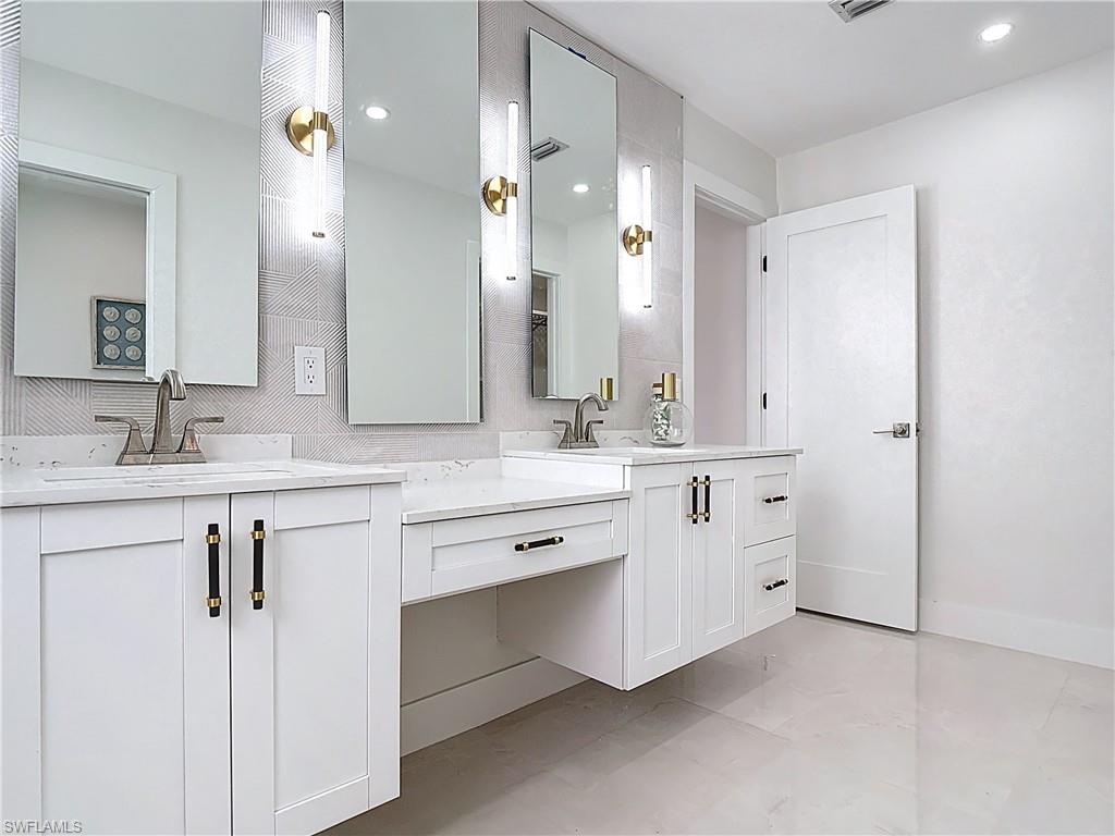 Bathroom featuring two vanities