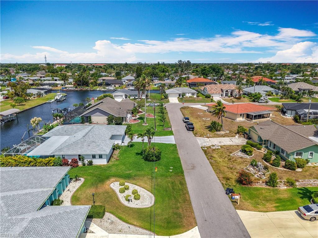 Aerial perspective of suburban area with a large body of water