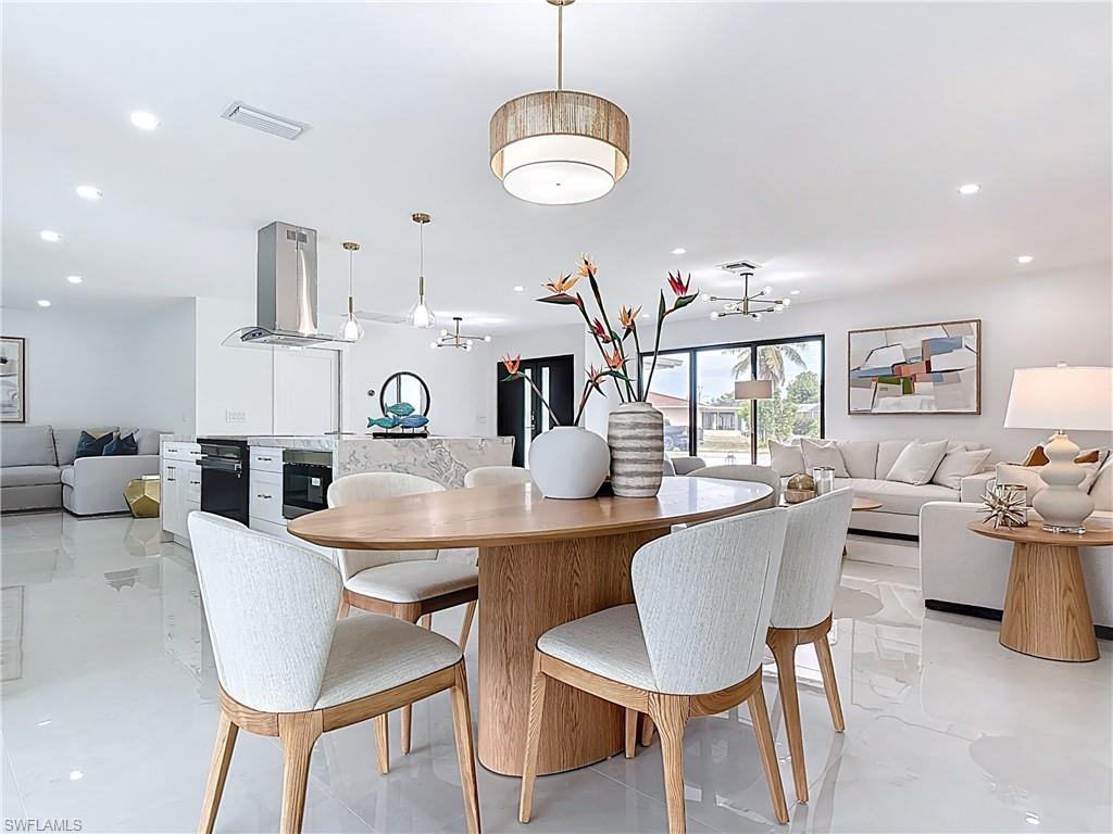 Dining space featuring a chandelier and recessed lighting