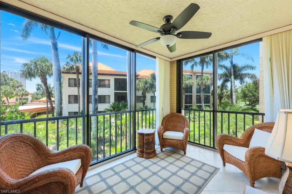 Sunroom / solarium with floor to ceiling windows and tile patterned flooring