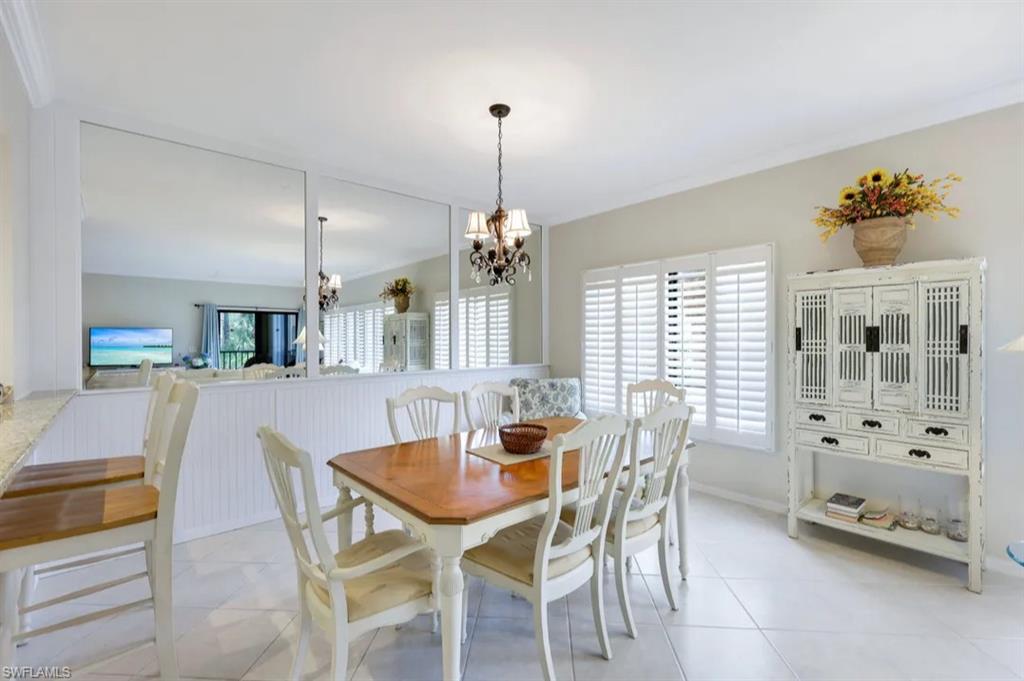 Dining space with a chandelier and light tile patterned floors