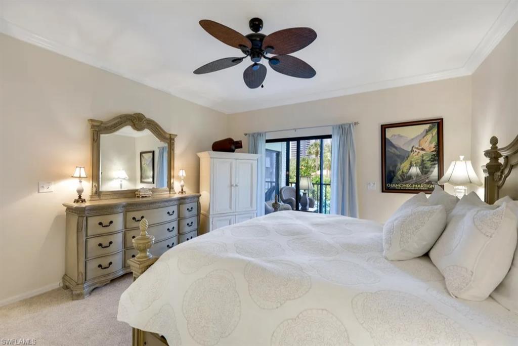 Bedroom featuring access to outside, light colored carpet, baseboards, a ceiling fan, and ornamental molding