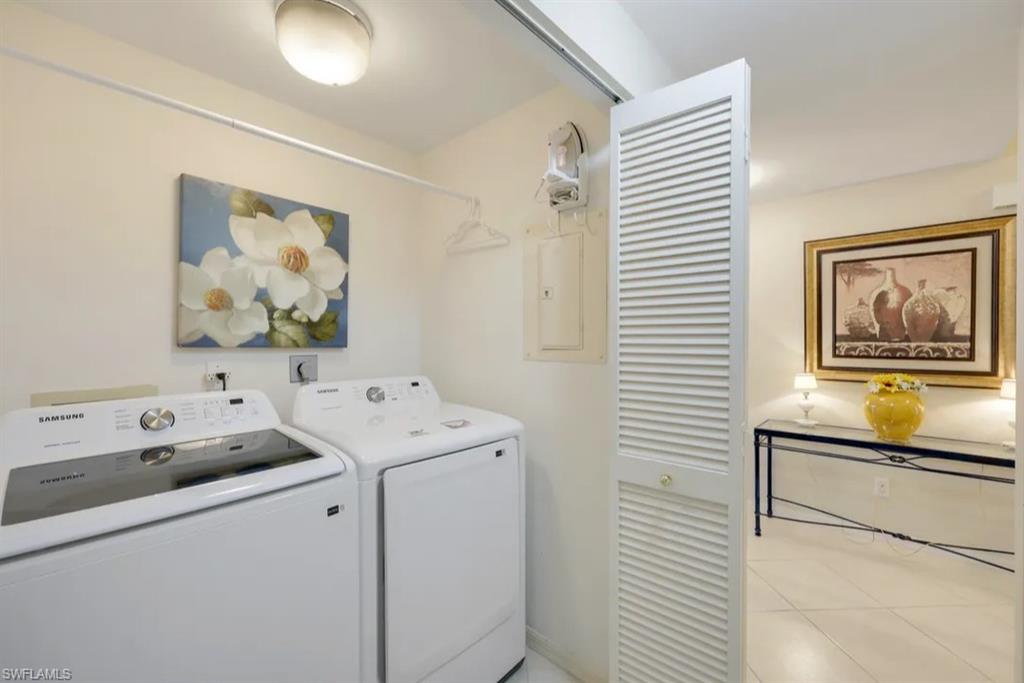Washroom with washing machine and dryer and electric panel
