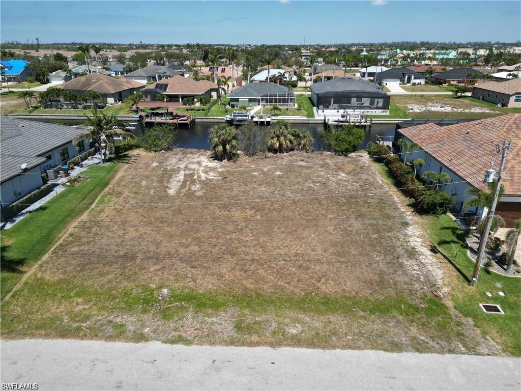 Aerial perspective of suburban area with a nearby body of water