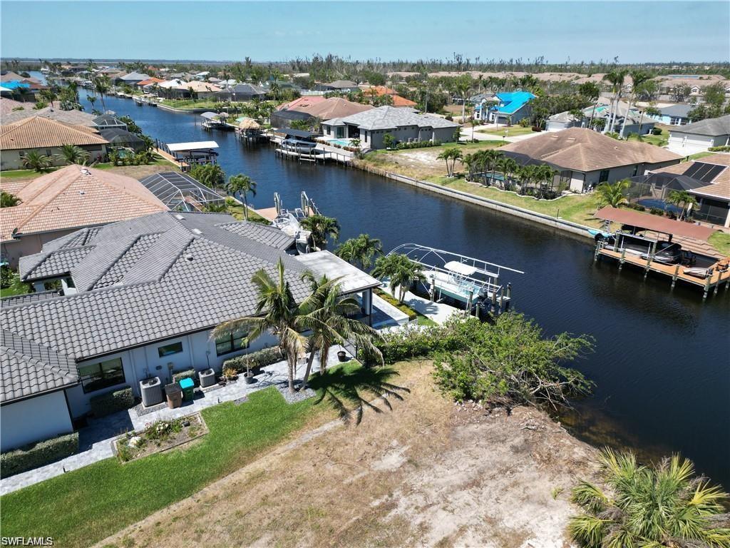 Aerial view of residential area with a nearby body of water