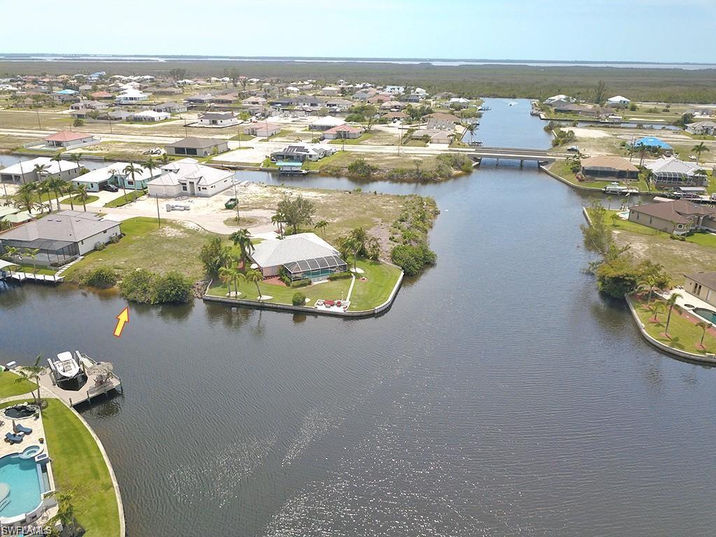 Aerial perspective of suburban area with a nearby body of water