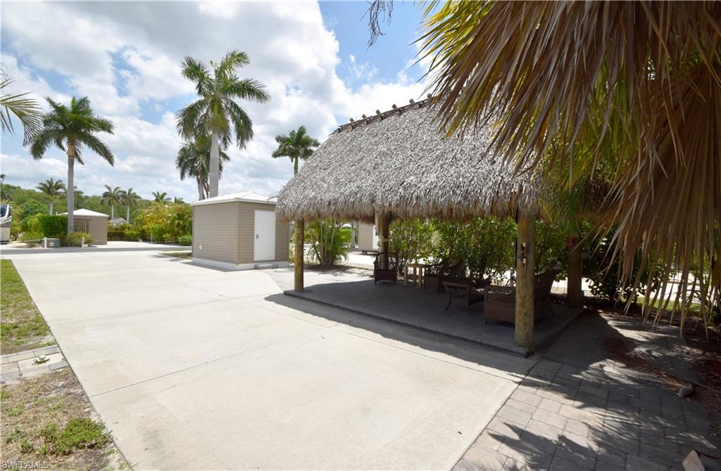 View of community featuring a storage shed, a gazebo, an outbuilding, and a patio area