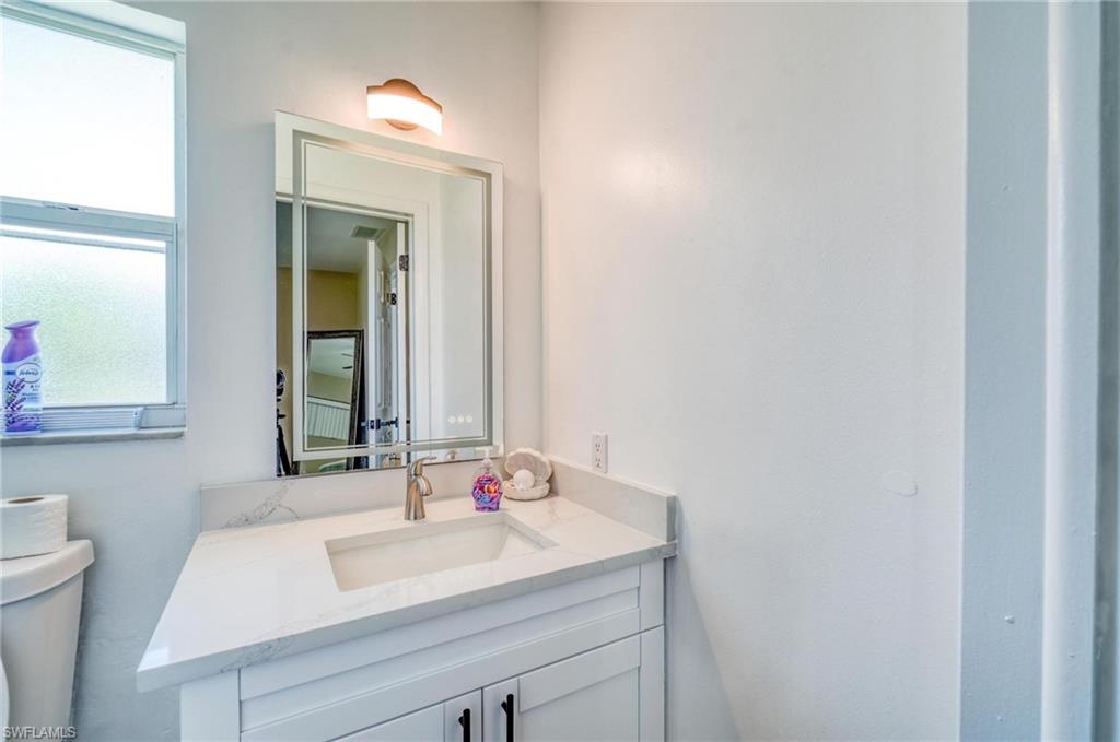 Bathroom with toilet and vanity