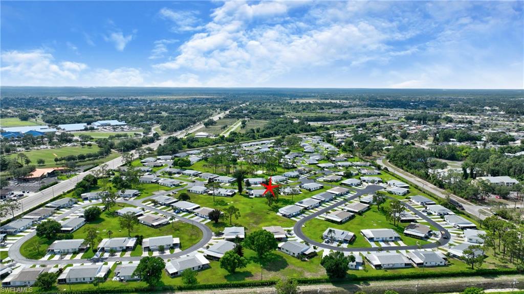 View of property location with nearby suburban area