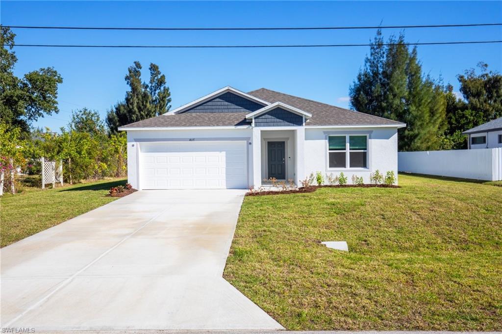 Ranch-style house with an attached garage, concrete driveway, roof with shingles, and stucco siding