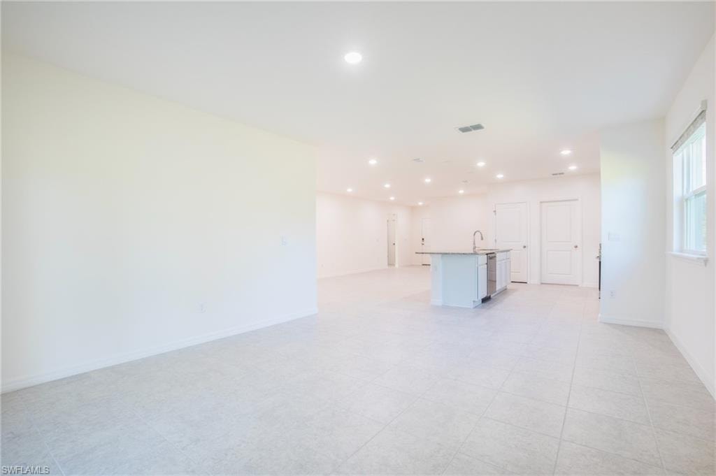 Unfurnished living room with recessed lighting