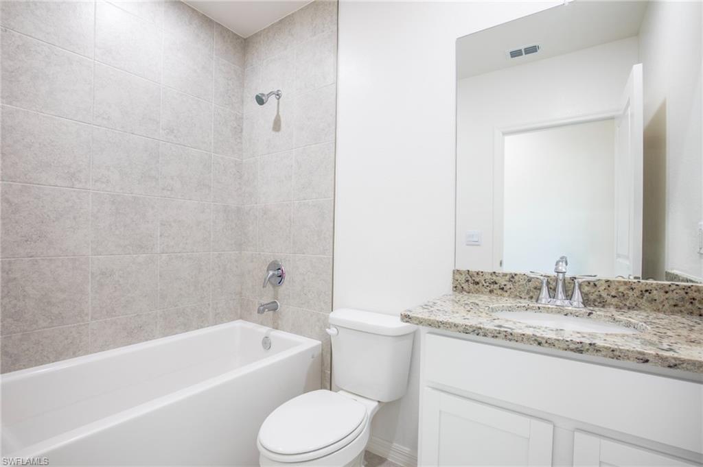 Full bath featuring vanity and shower / bathtub combination