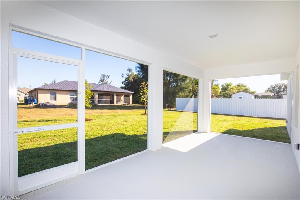 Unfurnished sunroom with a patio