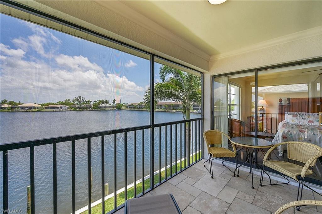 Sunroom with a water view and sliders to Primary Bedroom