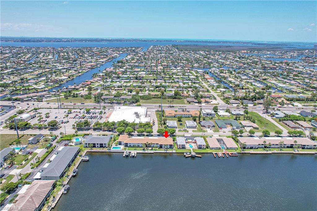 Aerial perspective of suburban area with a large body of water
