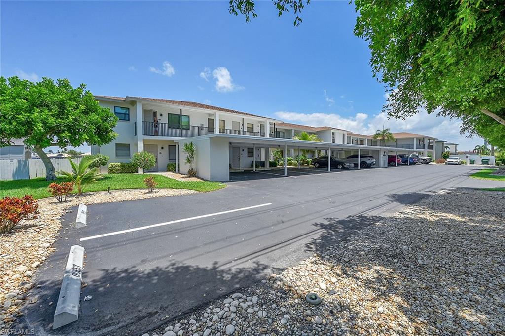 View of asphalt guest parking area