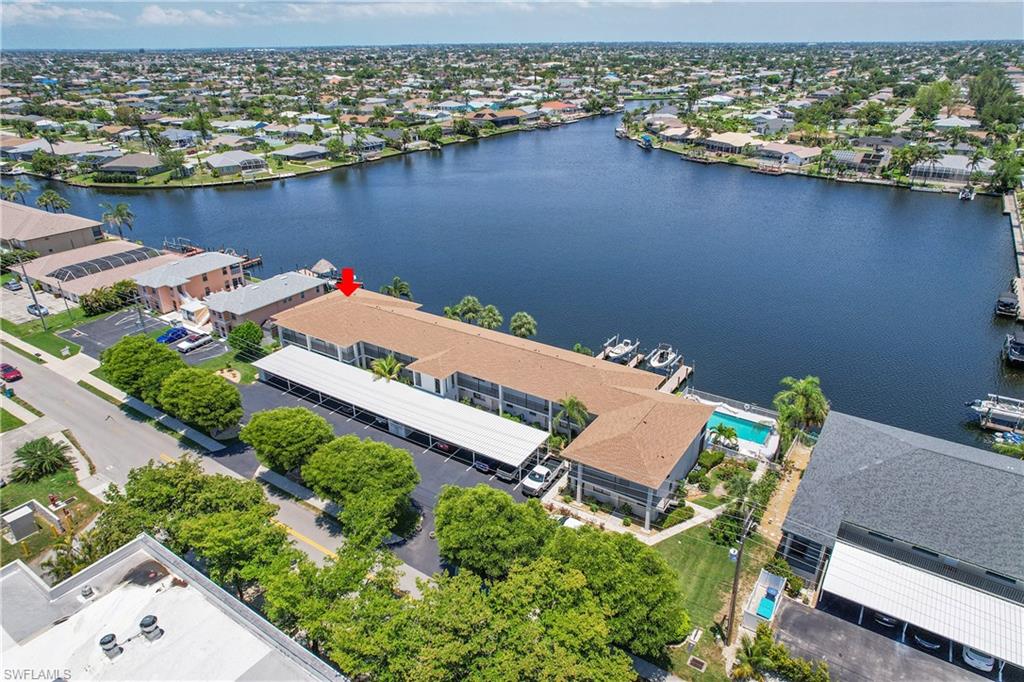 Aerial view of residential area featuring a large body of water