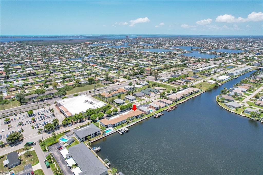 Aerial perspective of suburban area with a nearby body of water