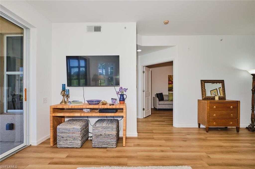 Living room with wood finished floors and baseboards