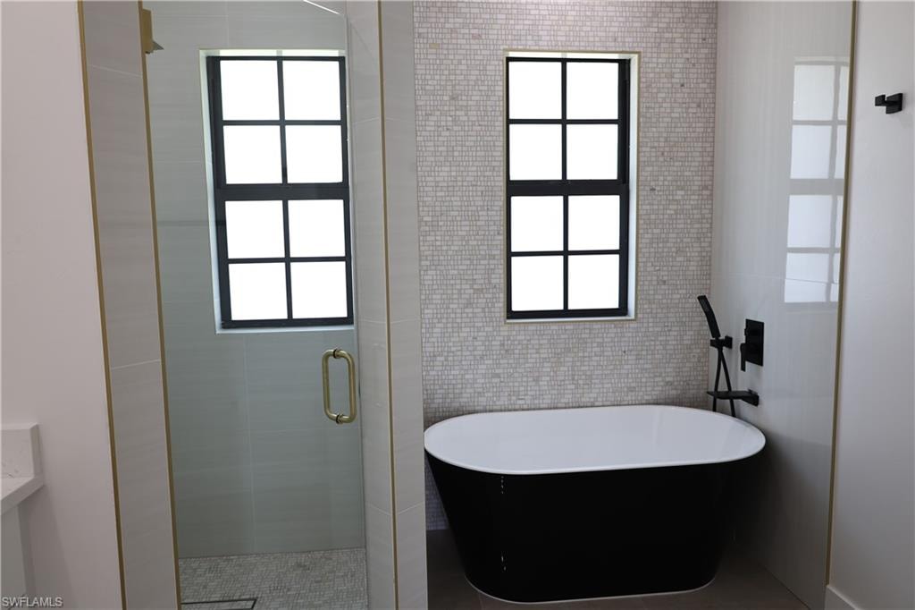 Bathroom with vanity and light tile patterned floors