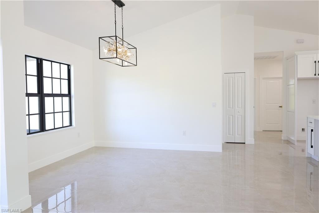 Doorway to outside with a chandelier and french doors