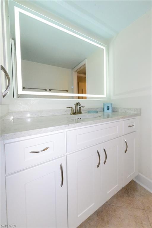 Bathroom featuring vanity and tile patterned flooring