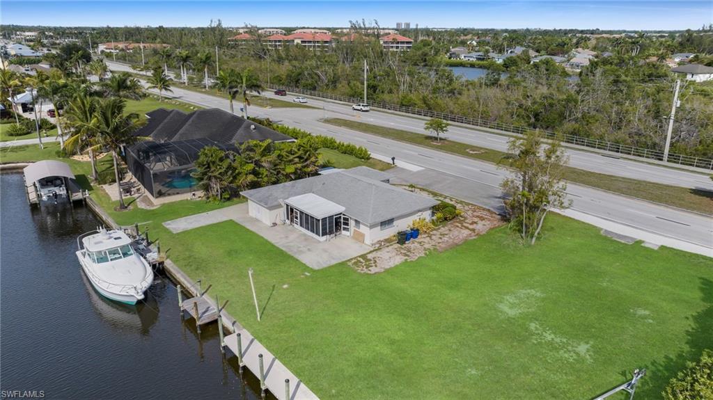 Aerial perspective of suburban area with a large body of water