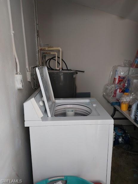 Laundry room featuring washer / clothes dryer and water heater