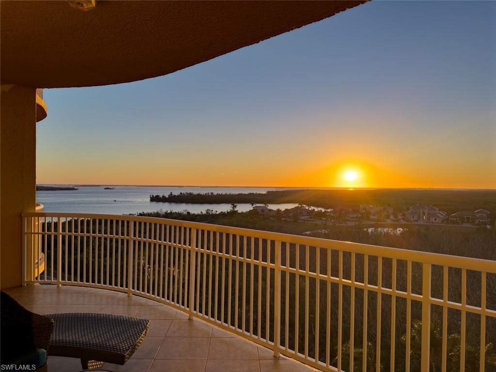 Balcony at dusk with a water view