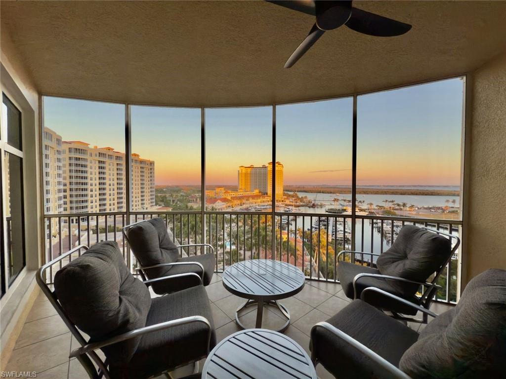 Screened Lanai with ceiling fan and a marina water view