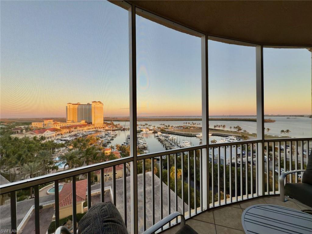Sunroom featuring a water view